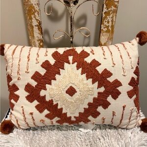Cozy Bohemian Cream Pillow with Terracotta Pom Poms